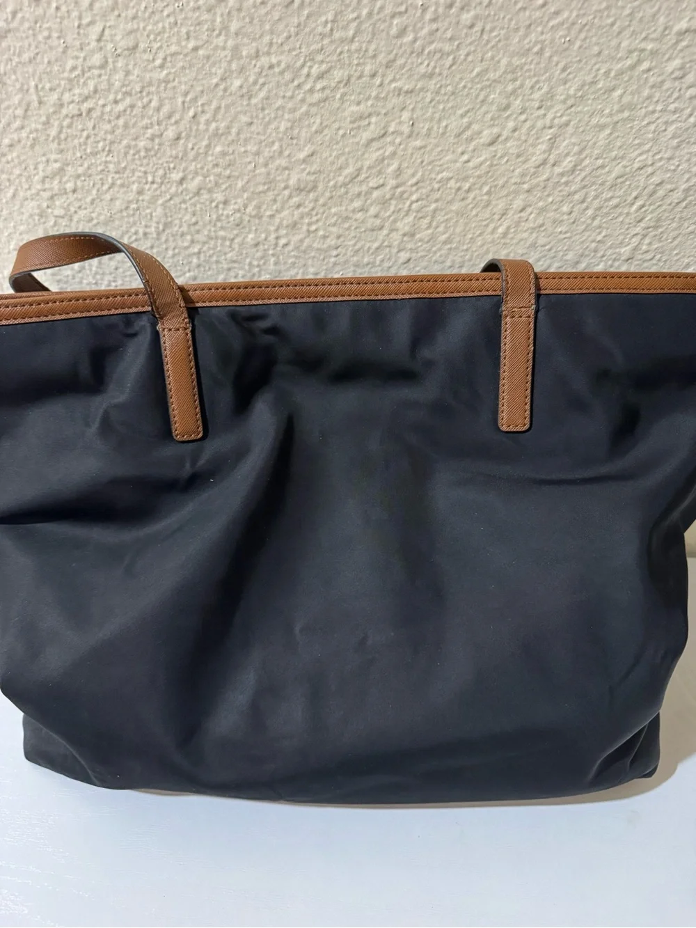 Michael Kors Black Tote with Brown Trim and Gold Plate